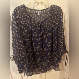 Long sleeve navy blouse with yellow flowers.